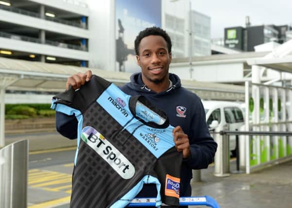 Carlin Isles arrives in Scotland. Picture: SNS