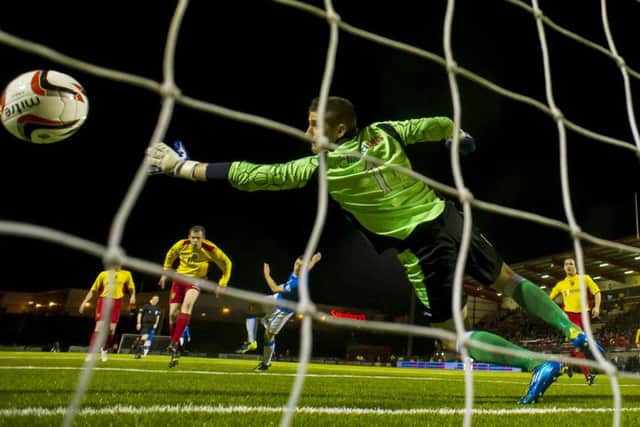 Fraser Aird fires the ball home to give Rangers the lead. Picture: SNS