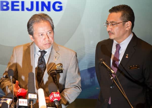 Malaysia's foreign minister Anifah Aman (left) and acting transport minister Hishammuddin Hussein host a press conference in Kuala Lumpur. Picture: Getty Images