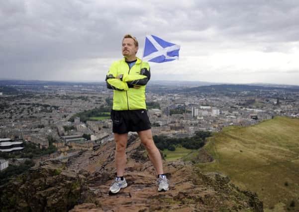 Eddie Izzard, pictured at the top of Edinburgh's Arthur's Seat in 2009. Picture: Jane Barlow