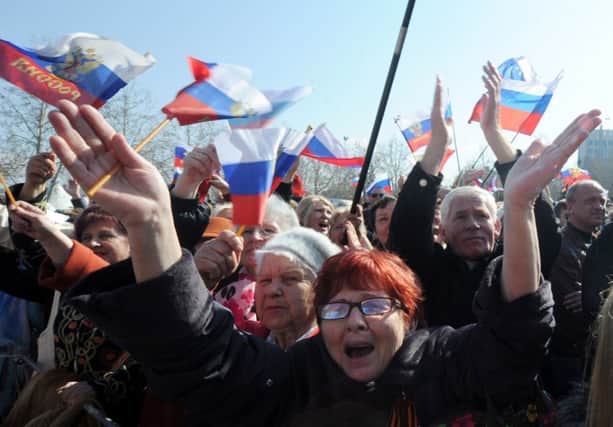Russians celebrate the annexing of Crimea. Picture: Getty