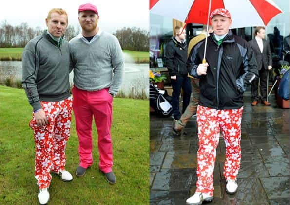 Lennon with Hartson, left and sheltering from the rain. Pictures: SNS