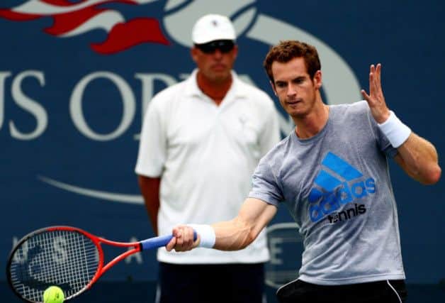 Andy Murray plays a shot during training, watched closely by Ivan Lendl. Picture: Getty