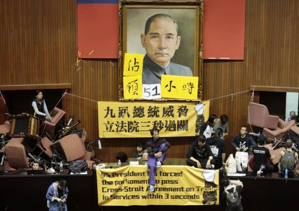 Anti-treaty protesters unfurl their banners in parliament. Picture: Getty