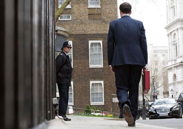 Chancellor George Osborne makes his way to Downing Street with the budget box. Picture: Getty