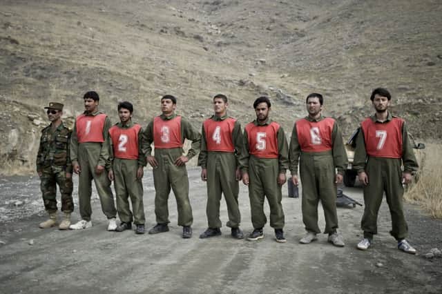 Afghan officer cadet hopefuls line up to await instructions for a team tasking exercise. Picture: PA