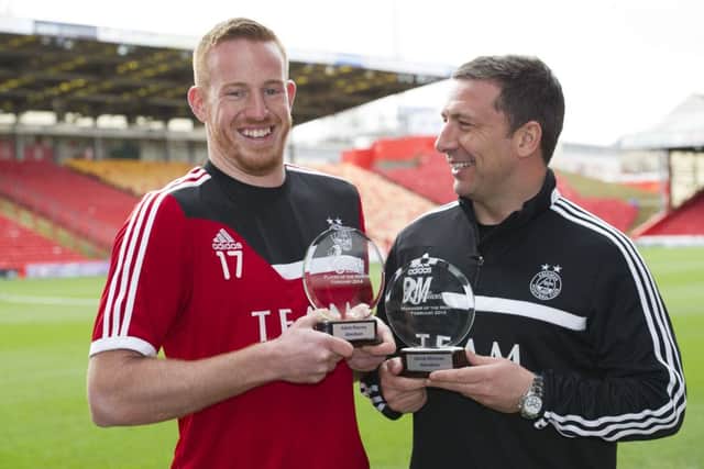 Aberdeen striker Adam Rooney, left, and Derek McInnes show off their awards. Picture: SNS