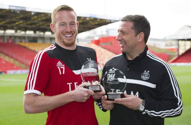 Aberdeen striker Adam Rooney, left, and Derek McInnes show off their awards. Picture: SNS