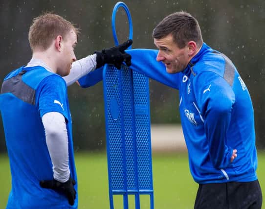 Steven Smith, left, and Lee McCulloch take a breather as Rangers prepare for Sundays game. Picture: SNS