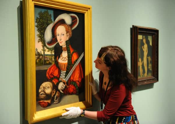 Curator Pippa Stephenson with a 1530 painting by Lucas Crannach the Elder. Picture: Robert Perry/TSPL