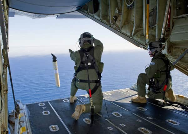 Australian air force launch a marker buoy from a Hercules in the southern Indian Ocean.  Picture: AP