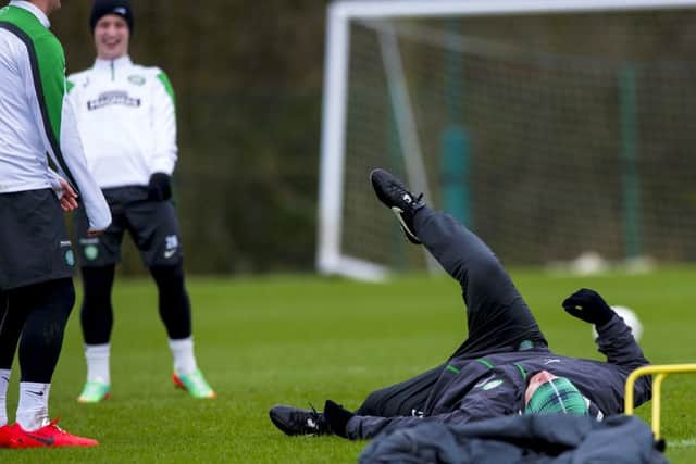 Neil Lennon gave his players a chuckle at Lennoxtown yesterday when he took a tumble. Picture: SNS