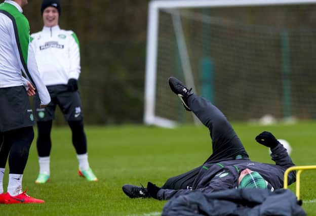 Neil Lennon gave his players a chuckle at Lennoxtown yesterday when he took a tumble. Picture: SNS