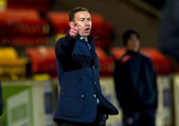 Ross County manager Derek Adams has seen his side struggle in away games this season. Picture: SNS