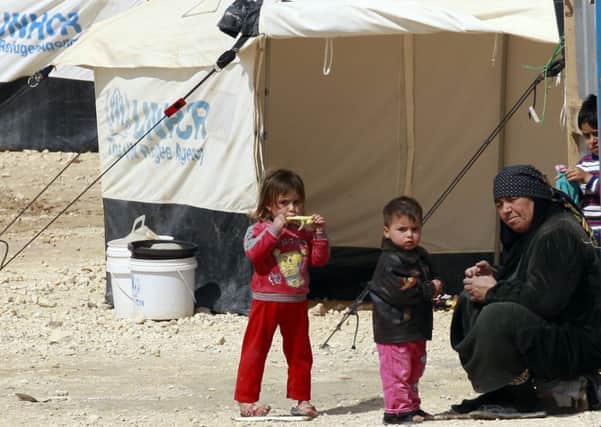 A family takes refuge at a camp in northern Jordan which shelters 100,000 Syrian refugees. Picture: Getty