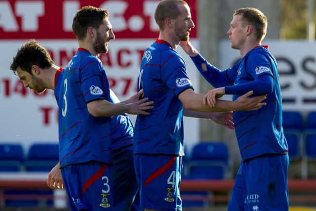 Billy McKay, far right, is congratulated after scoring the only goal of the game. Picture: SNS
