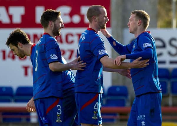 Billy McKay, far right, is congratulated after scoring the only goal of the game. Picture: SNS
