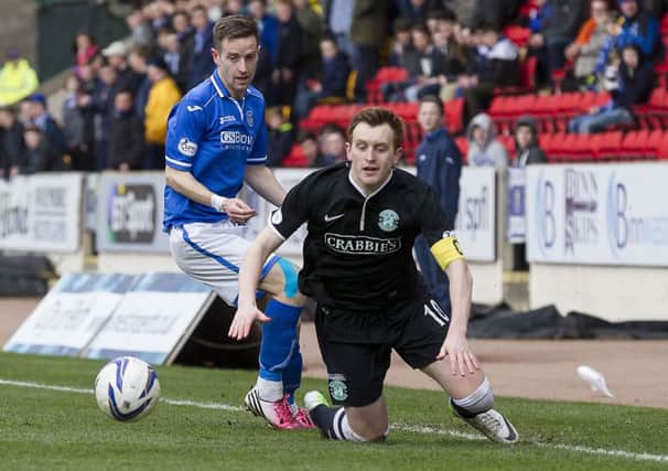 Scorer of Saints' first goal Steven MacLean clashes with Hibernian's Liam Craig. Picture: SNS