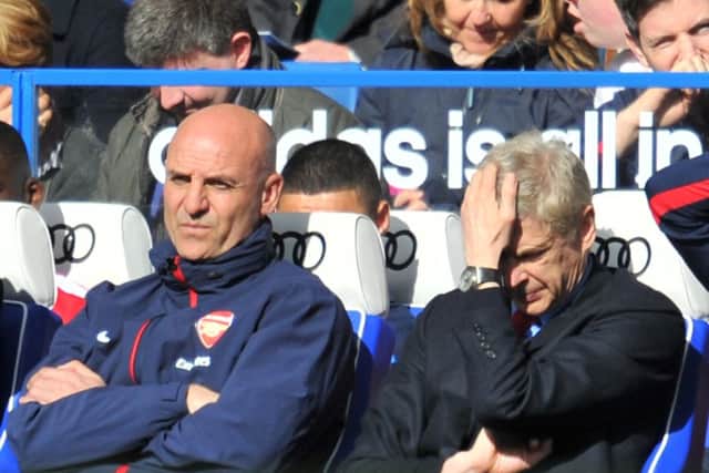 Arsene Wenger can't bear to look as Chelsea demolish Arsenal 6-0 at Stamford Bridge. Picture: AFP/Getty