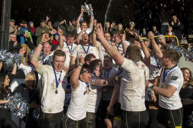 Delight for the Melrose squad as they celebrate with the RBS Premiership trophy at the Greenyards. Photograph: SNS