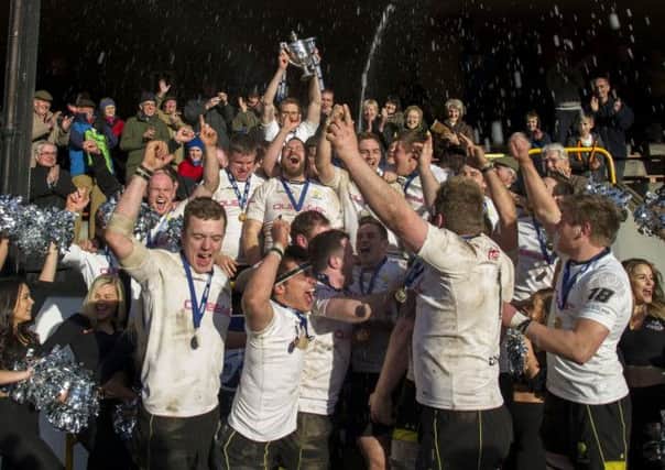 Delight for the Melrose squad as they celebrate with the RBS Premiership trophy at the Greenyards. Photograph: SNS