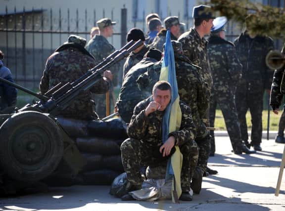 A Ukrainian officer before his air base was seized. Picture: Getty