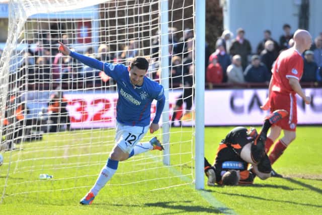 Rangers substitute Nicky Clark dashes off to celebrate after scoring with his first touch of the ball. Picture: SNS
