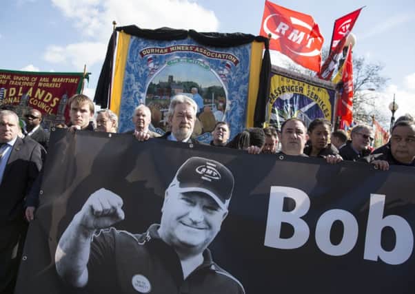 Well-wishers prepare to greet the horse-drawn funeral cortege of RMT General Secretary Bob Crow. Picture: Getty