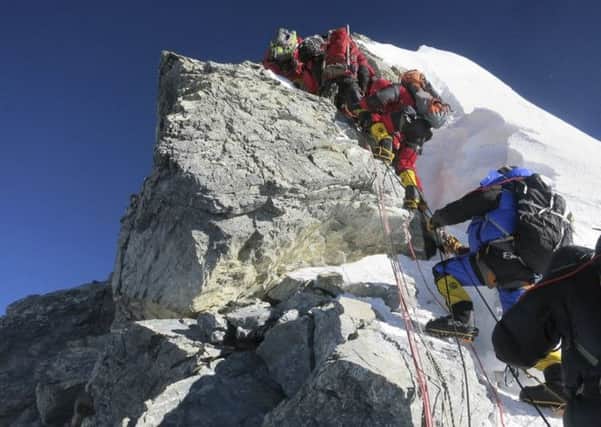 A line of climbers navigate the Hillary Step just below the summit of Mount Everest. Picture: AP