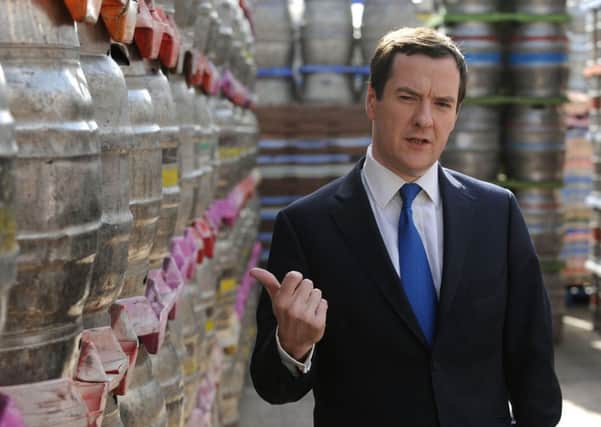 Chancellor George Osborne views a store of kegs during a visit to Marston's Brewery in Wolverhampton. Picture: PA