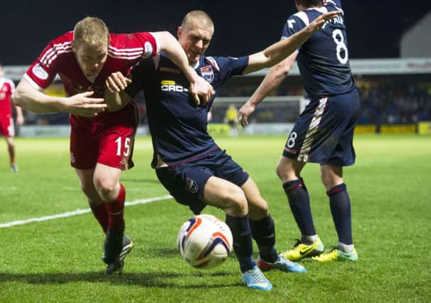 Aberdeen's Barry Robson (left) battles with Erik Cikos. Picture: SNS