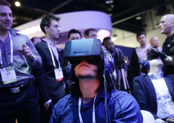 A player wears an Oculus Rift headset during January's CES show in Las Vegas. Picture: AP