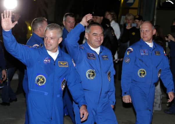 Swanson, Skvortsov and Artemyev before launch. Picture: Reuters