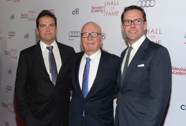 Rupert Murdoch (middle) has given son's Lachlan Murdoch (left) and James Murdoch (right) top roles. Picture: Getty
