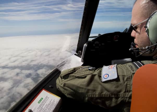 An Australian plane conducts an aerial search for missing Flight MH370. Picture: Getty