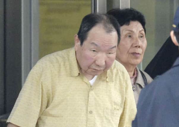 Iwao Hakamada, 78, walks free, his sister Hideko just behind him, after his appeal victory. Picture: Reuters