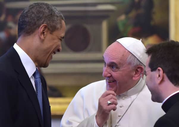 Barack Obama and Pope Francis are all smiles as they meet at the Vatican. Picture: Getty
