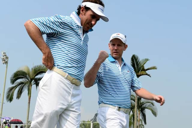 Gonzalo Fernandez-Castano and Stephen Gallacher walk off the first tee during the foursome matches. Picture: Getty