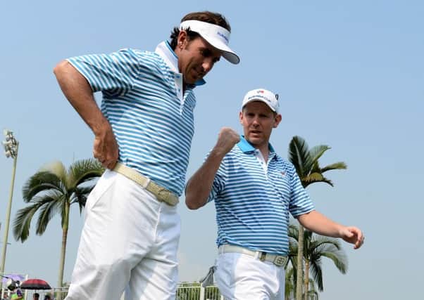 Gonzalo Fernandez-Castano and Stephen Gallacher walk off the first tee during the foursome matches. Picture: Getty