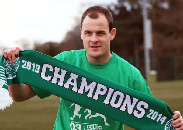 Anthony Stokes celebrates Celtic's title win - but the striker was fuming after his car was towed. Picture: PA