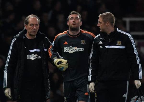 Allan McGregor walks off in pain after being injured and red carded. Picture: PA