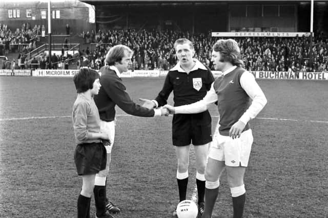 Captains Jim Brown and John Blackley shake hands before the derby  match kicks off at Tynecastle. Picture: Alan Ledgerwood