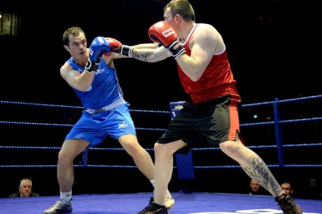 Heavyweights Stephen Lavelle, left, and Gary Fairgrieve trade blows in Glasgow last night. Picture: SNS