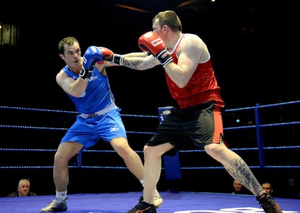 Heavyweights Stephen Lavelle, left, and Gary Fairgrieve trade blows in Glasgow last night. Picture: SNS