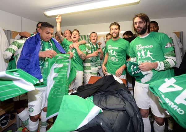 Celtic players celebrate their title win. Picture: SNS