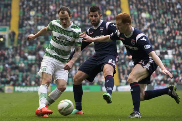 Anthony Stokes takes on Ross County's Evangelos Oikonomou (centre) and Scott Boyd (right). Picture: PA
