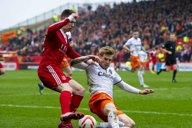 Aberdeen's Ryan Jack (left) battles for the ball with Stuart Armstrong. Picture: SNS
