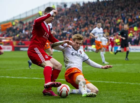 Aberdeen's Ryan Jack (left) battles for the ball with Stuart Armstrong. Picture: SNS