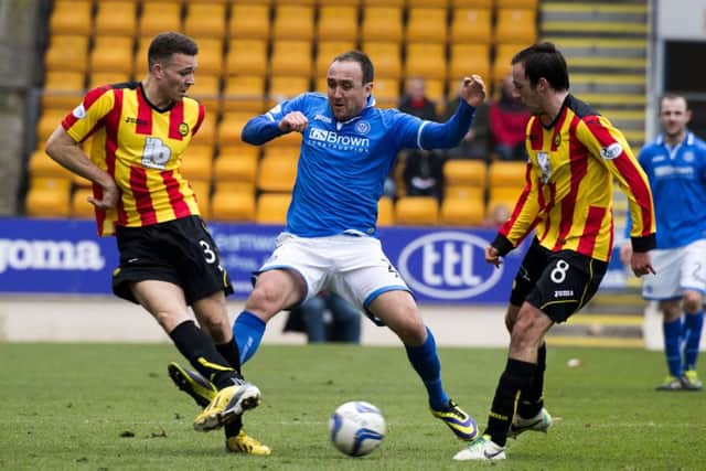 Partick's Aaron Taylor-Sinclair (left) and Stuart Bannigan (right) try to close down Lee Croft. Picture: SNS