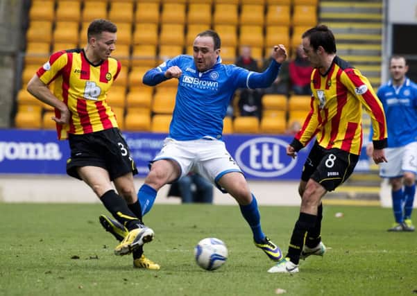 Partick's Aaron Taylor-Sinclair (left) and Stuart Bannigan (right) try to close down Lee Croft. Picture: SNS